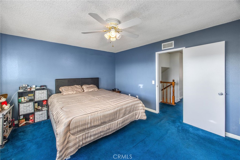 10399 Monte Vista Street Rancho Cucamonga, CA 91701 - Photo 34 of 43 a bedroom with a bed and wooden floor
