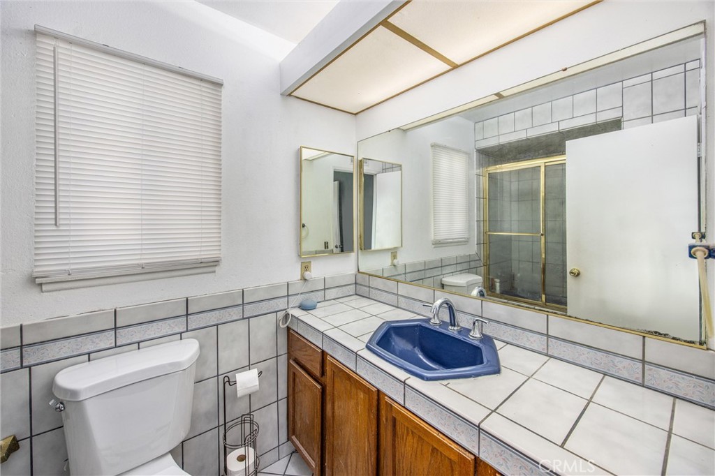 10399 Monte Vista Street Rancho Cucamonga, CA 91701 - Photo 35 of 43 a bathroom with a sink and a mirror