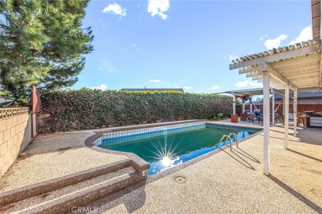 10399 Monte Vista Street Rancho Cucamonga, CA 91701 - Photo 36 of 43 a view of a swimming pool with a lounge chairs
