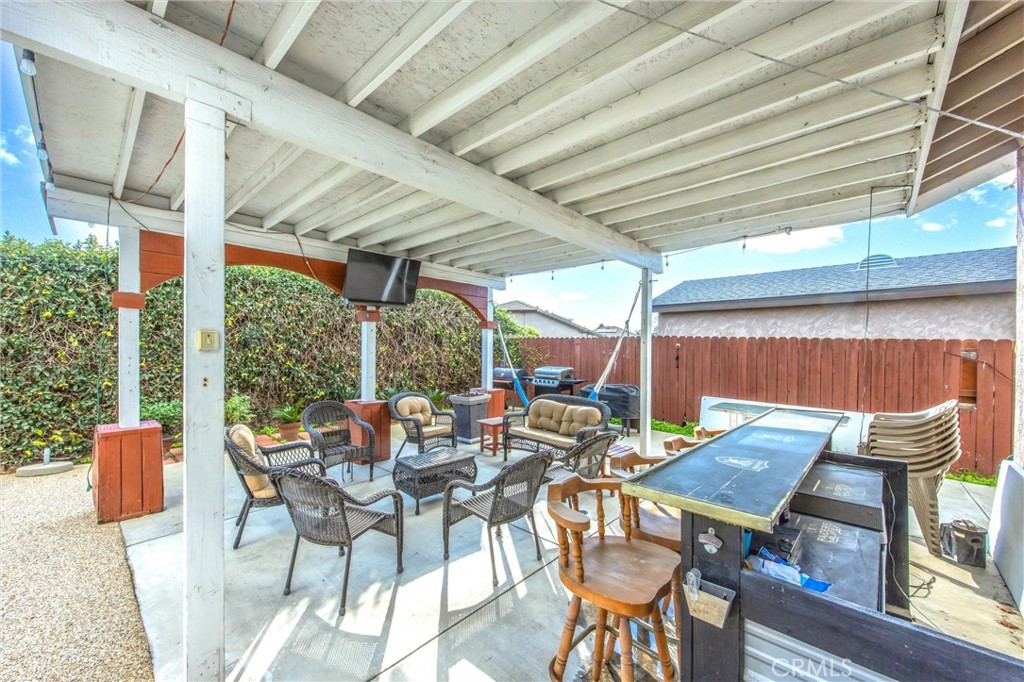 10399 Monte Vista Street Rancho Cucamonga, CA 91701 - Photo 37 of 43 a view of a patio with table and chairs and couches with wooden floor