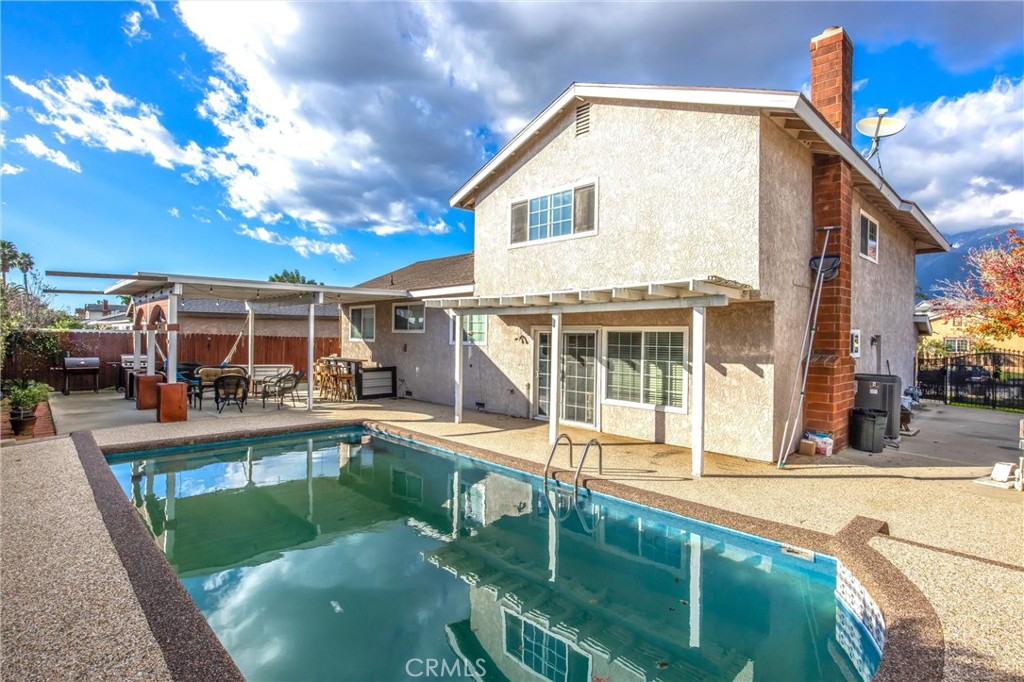 10399 Monte Vista Street Rancho Cucamonga, CA 91701 - Photo 42 of 43 a view of a house with swimming pool and sitting area