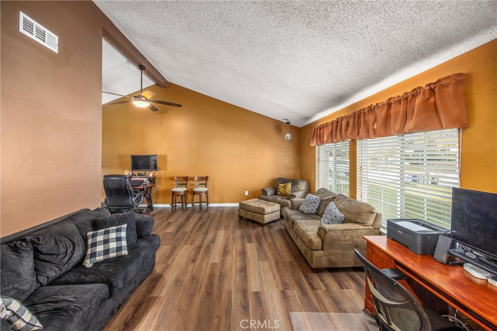 10399 Monte Vista Street Rancho Cucamonga, CA 91701 - Photo 7 of 43 a living room with furniture and a wooden floor