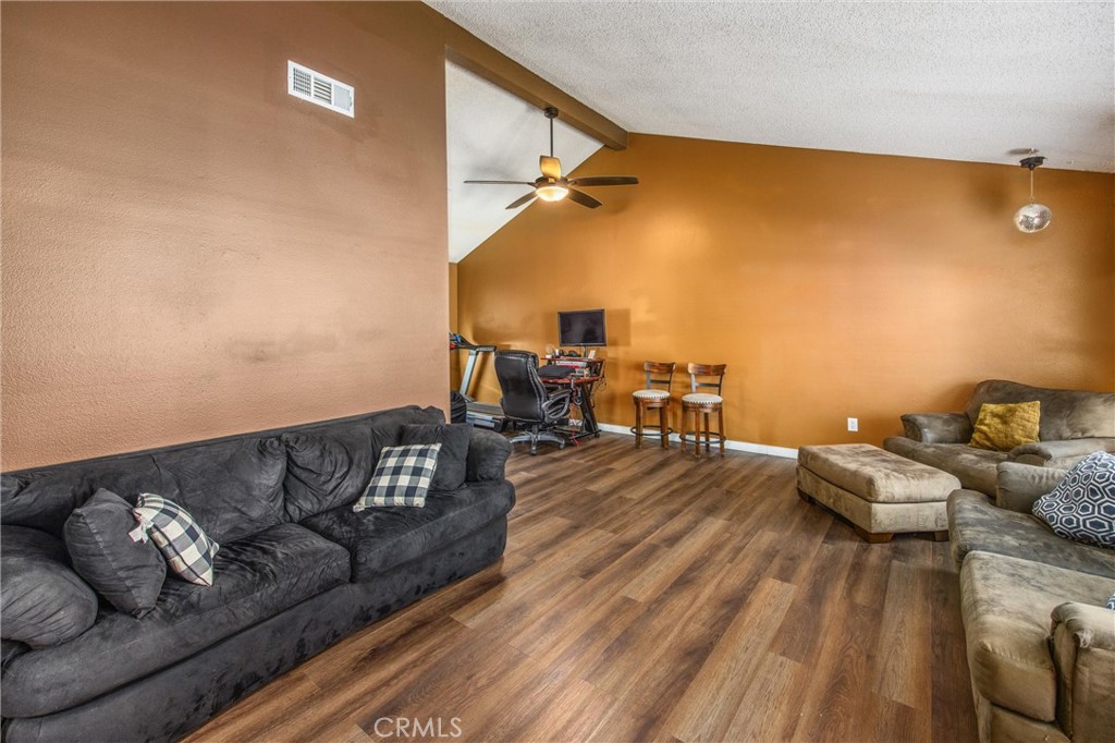 10399 Monte Vista Street Rancho Cucamonga, CA 91701 - Photo 8 of 43 a living room with couch and a wooden floor
