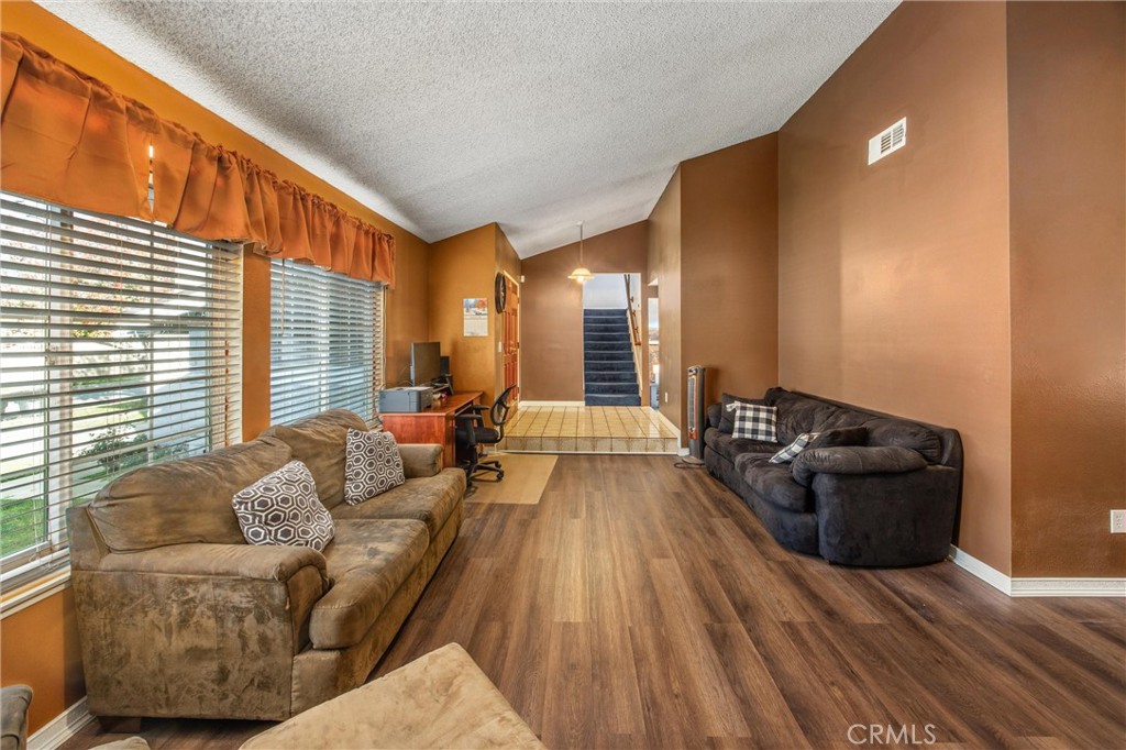10399 Monte Vista Street Rancho Cucamonga, CA 91701 - Photo 9 of 43 a living room with furniture and a large window