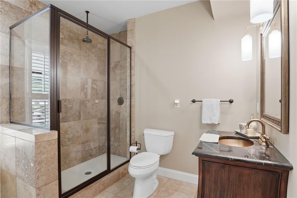 2950 Callie Still Road Lawrenceville, GA 30045 - Photo 42 of 77 a bathroom with a sink toilet and shower