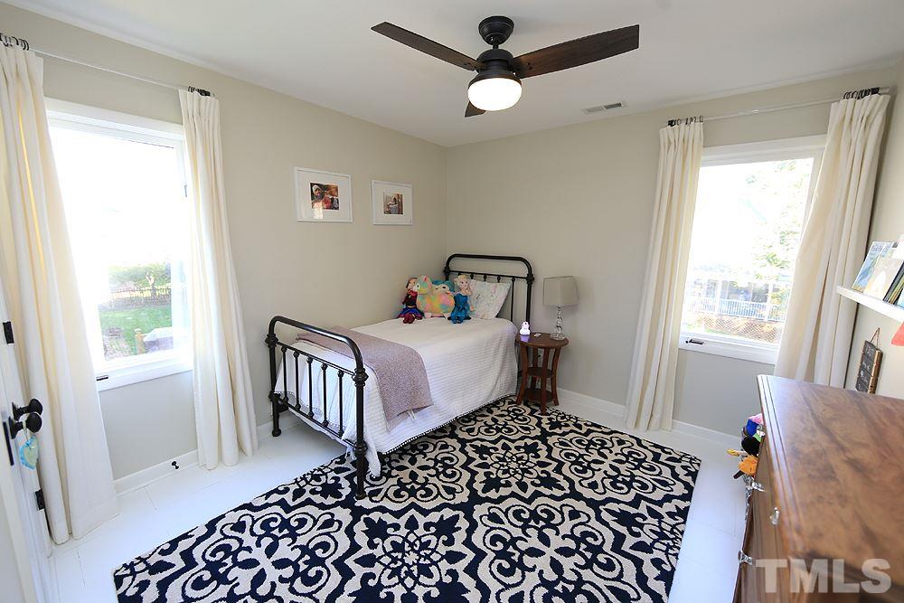 4100 Stemmons Court Raleigh, NC 27613 - Photo 11 of 13 a bedroom with a bed and a window