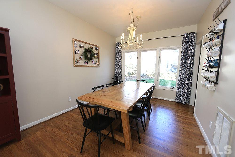 4100 Stemmons Court Raleigh, NC 27613 - Photo 3 of 13 a view of a dining room with furniture window and wooden floor