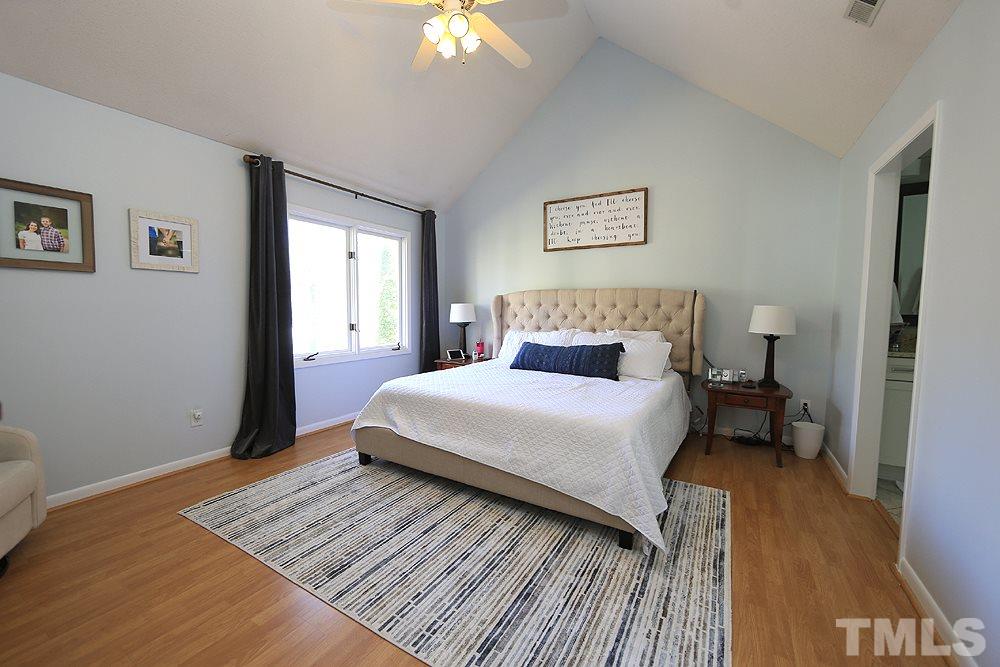 4100 Stemmons Court Raleigh, NC 27613 - Photo 8 of 13 a bedroom with a bed and a window