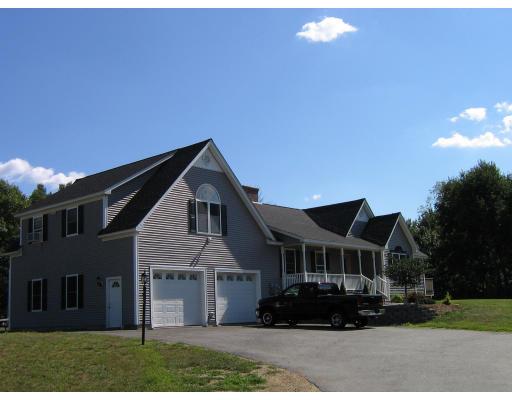 48 Danville Road Kingston, NH 03848 - Photo 2 of 12 a front view of a house with a garden