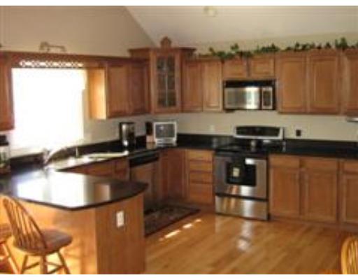 48 Danville Road Kingston, NH 03848 - Photo 6 of 12 a kitchen with a sink stove and microwave