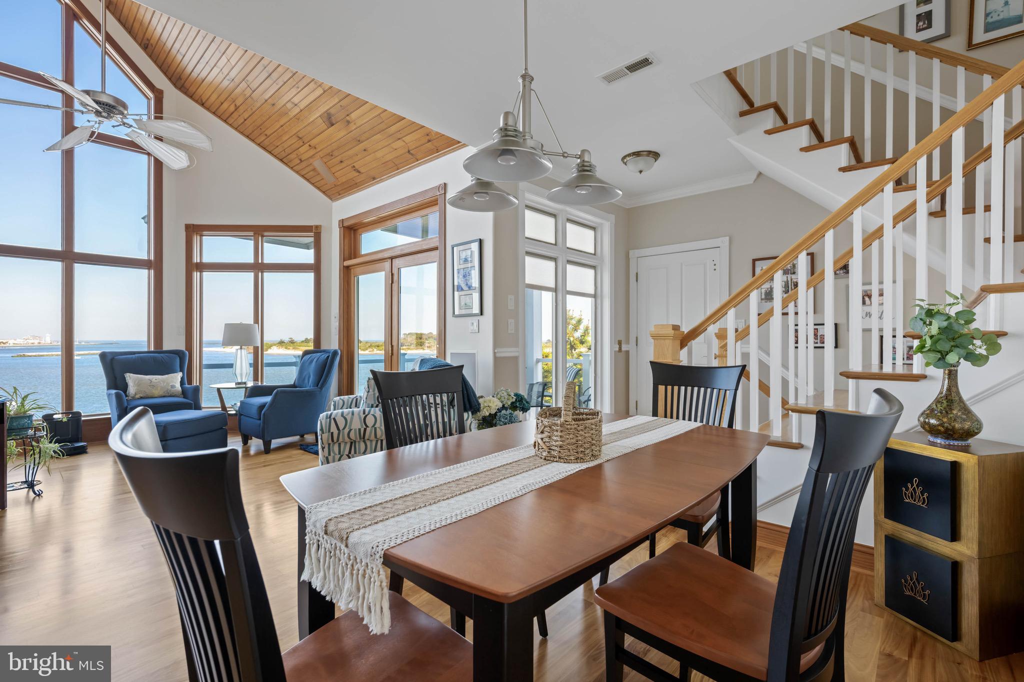 12959 Harbor Road Ocean City, MD 21842 - Photo 18 of 85 a view of a dining room with furniture window and wooden floor