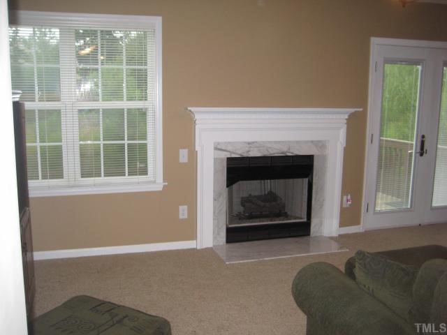 408 Firefly Road Holly Springs, NC 27540 - Photo 3 of 10 New Carpet, New French Door, Fresh Paint, Gas Log Fireplace