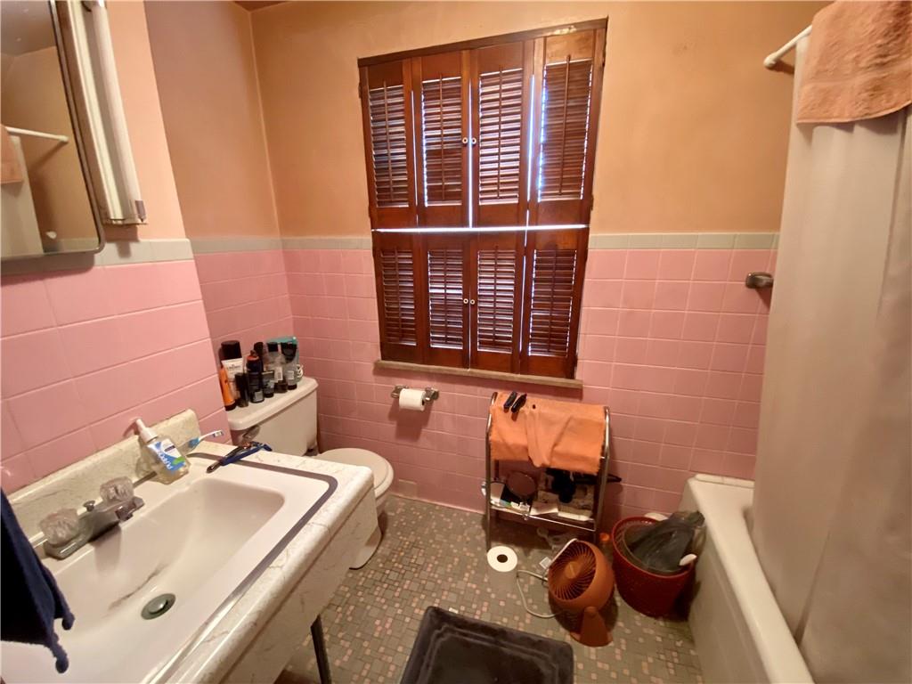 1590 Old Brodhead Road Monaca, PA 15061 - Photo 17 of 29 a bathroom with a sink and a mirror