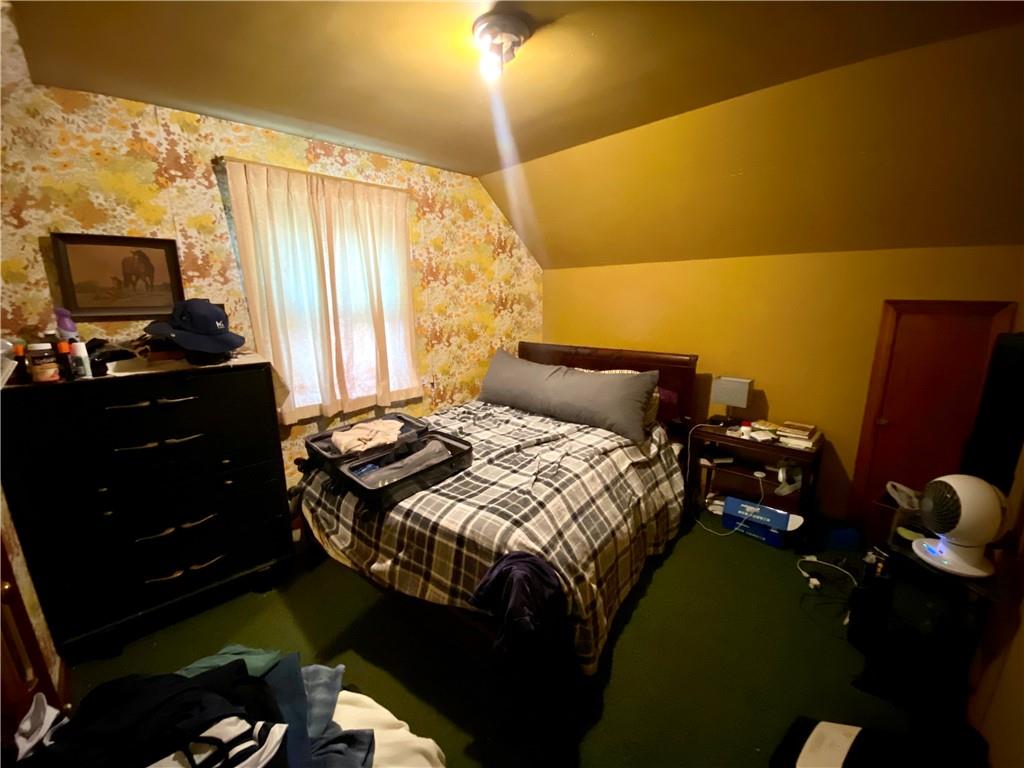 1590 Old Brodhead Road Monaca, PA 15061 - Photo 20 of 29 a bedroom with a bed and a flat screen tv