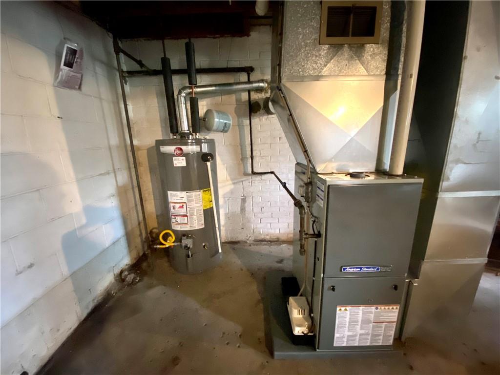 1590 Old Brodhead Road Monaca, PA 15061 - Photo 23 of 29 a view of water heater room with wooden floor