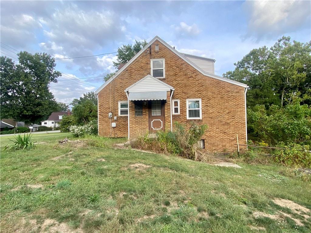 1590 Old Brodhead Road Monaca, PA 15061 - Photo 26 of 29 a front view of a house with garden