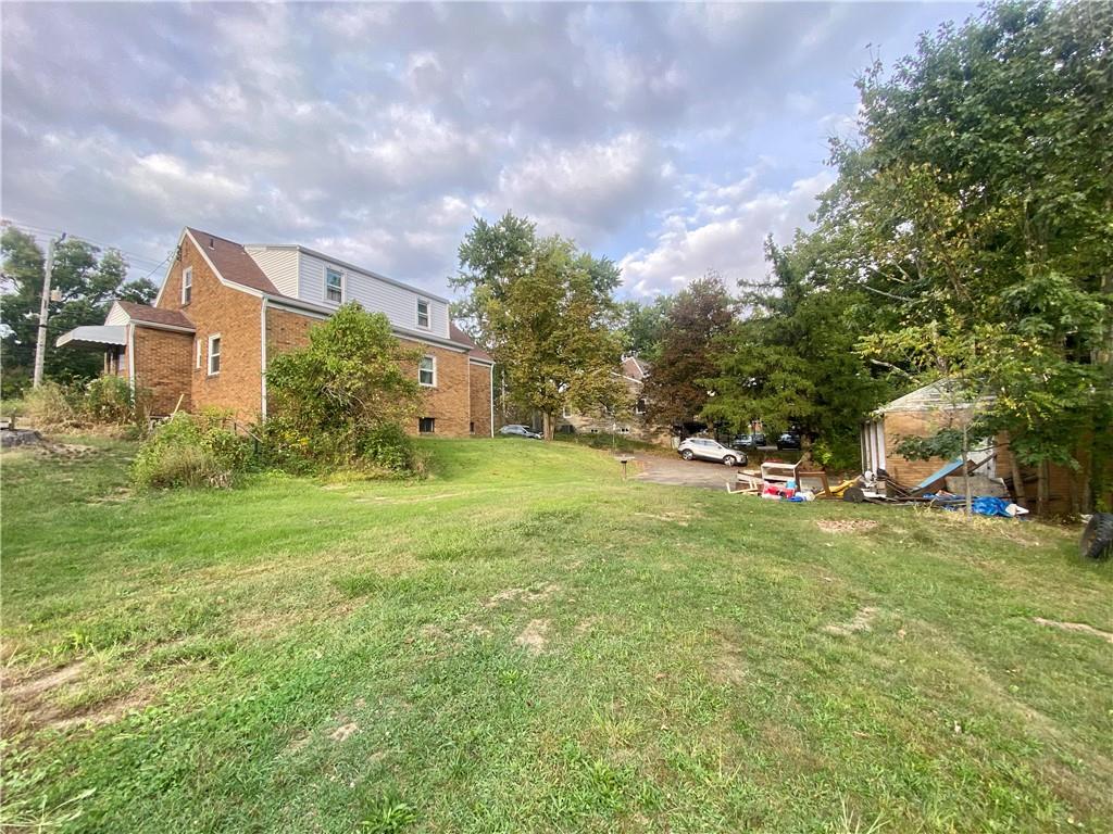 1590 Old Brodhead Road Monaca, PA 15061 - Photo 28 of 29 a view of a house with a big yard and large trees