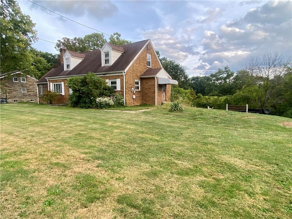 1590 Old Brodhead Road Monaca, PA 15061 - Photo 5 of 29 a house with huge green field in front of it