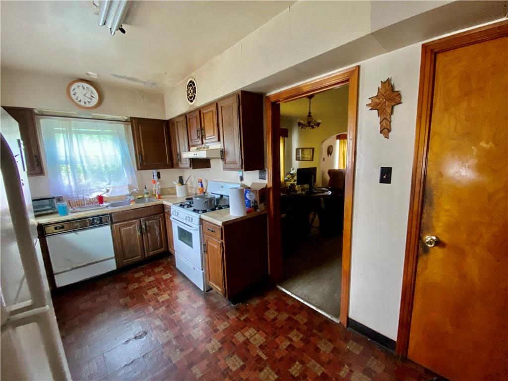 1590 Old Brodhead Road Monaca, PA 15061 - Photo 9 of 29 a kitchen with a refrigerator and a stove