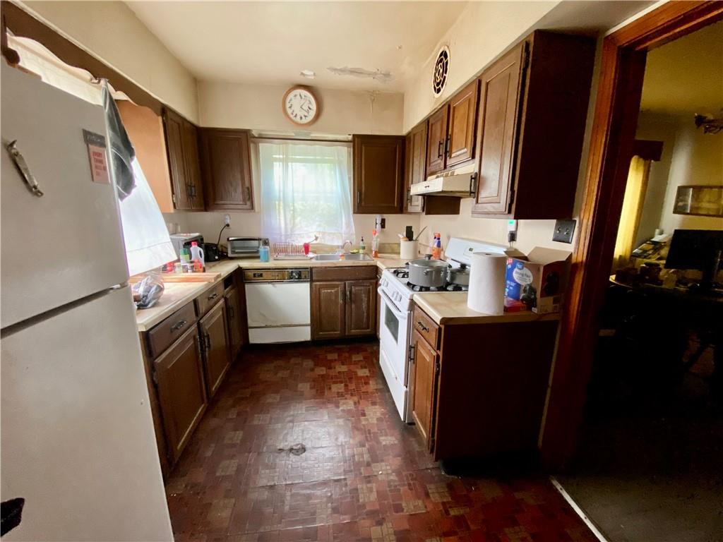 1590 Old Brodhead Road Monaca, PA 15061 - Photo 10 of 29 a kitchen with a sink stove and refrigerator