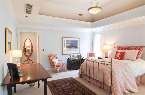 65 Lincoln Road Sudbury, MA 01776 - Photo 18 of 24 a bedroom with bed and glass table