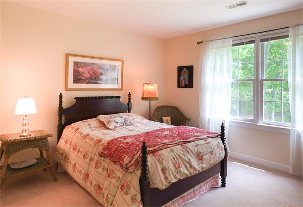 65 Lincoln Road Sudbury, MA 01776 - Photo 21 of 24 a bedroom with a bed and a window