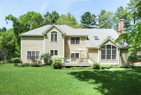 65 Lincoln Road Sudbury, MA 01776 - Photo 23 of 24 a front view of a house with a yard