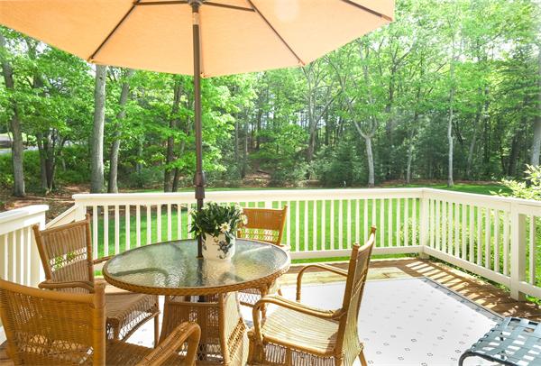 65 Lincoln Road Sudbury, MA 01776 - Photo 24 of 24 a view of a chairs and table on the deck