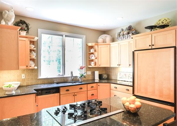 65 Lincoln Road Sudbury, MA 01776 - Photo 5 of 24 a kitchen with stainless steel appliances granite countertop a sink and a refrigerator