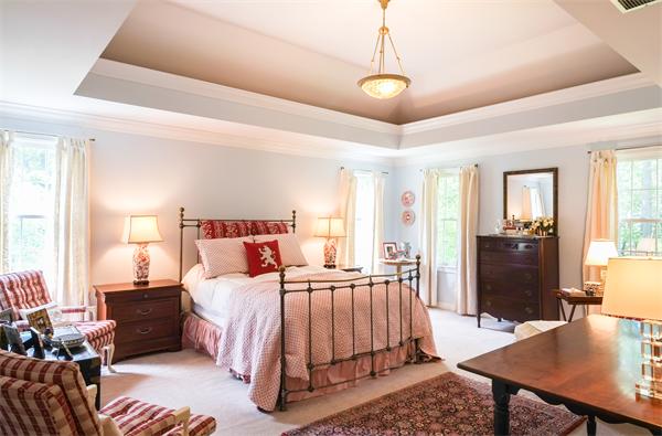 65 Lincoln Road Sudbury, MA 01776 - Photo 6 of 24 a bedroom with a bed and wooden floor