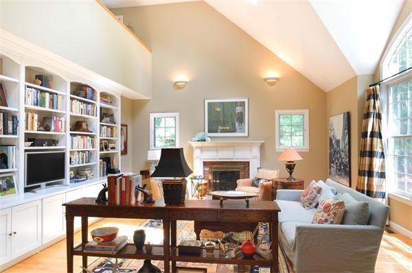 65 Lincoln Road Sudbury, MA 01776 - Photo 9 of 24 a living room with furniture and a fireplace