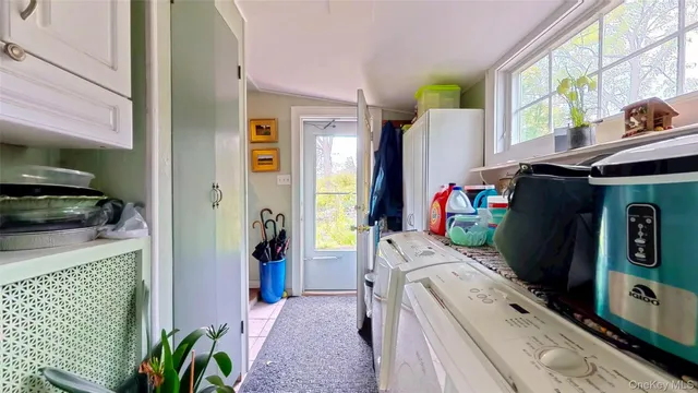 a utility room with dryer and washer