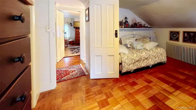 a bedroom with furniture and baby crib