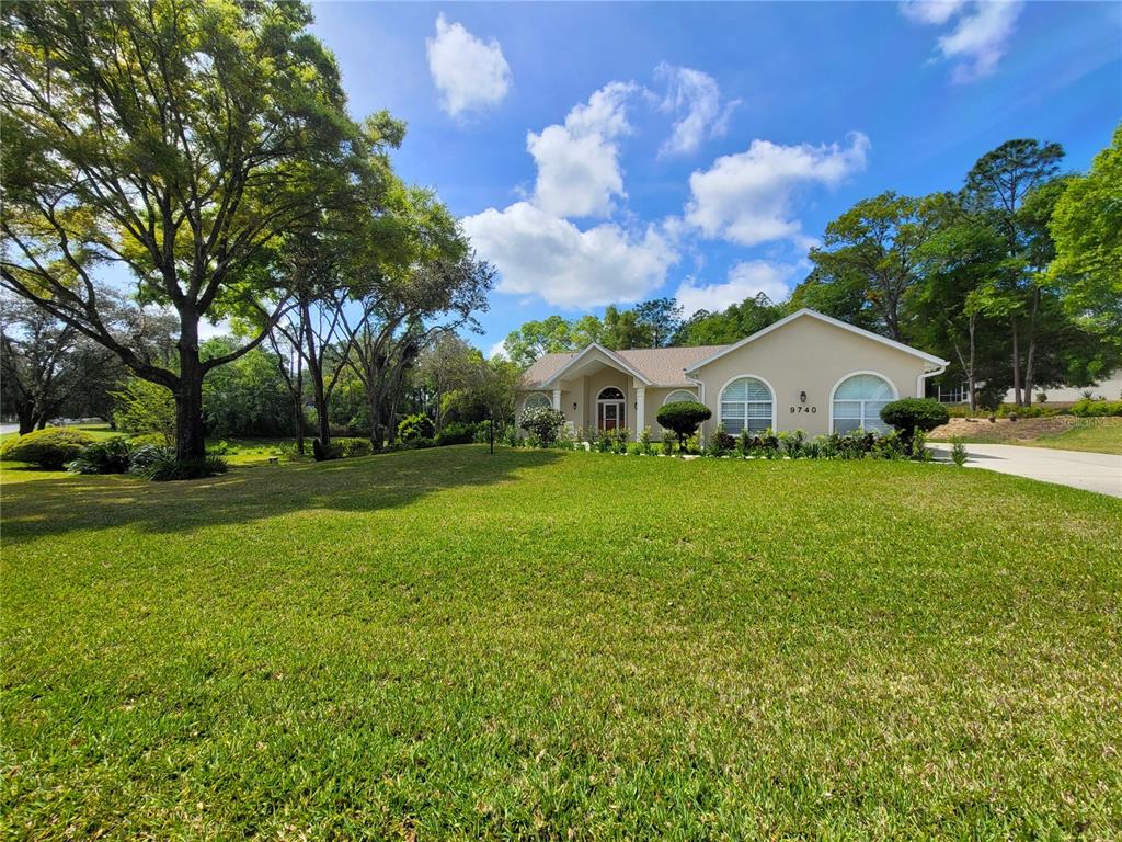 a house view with garden space