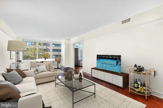 a living room with furniture and a window