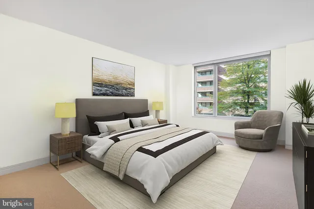 a bedroom with bed and a large window