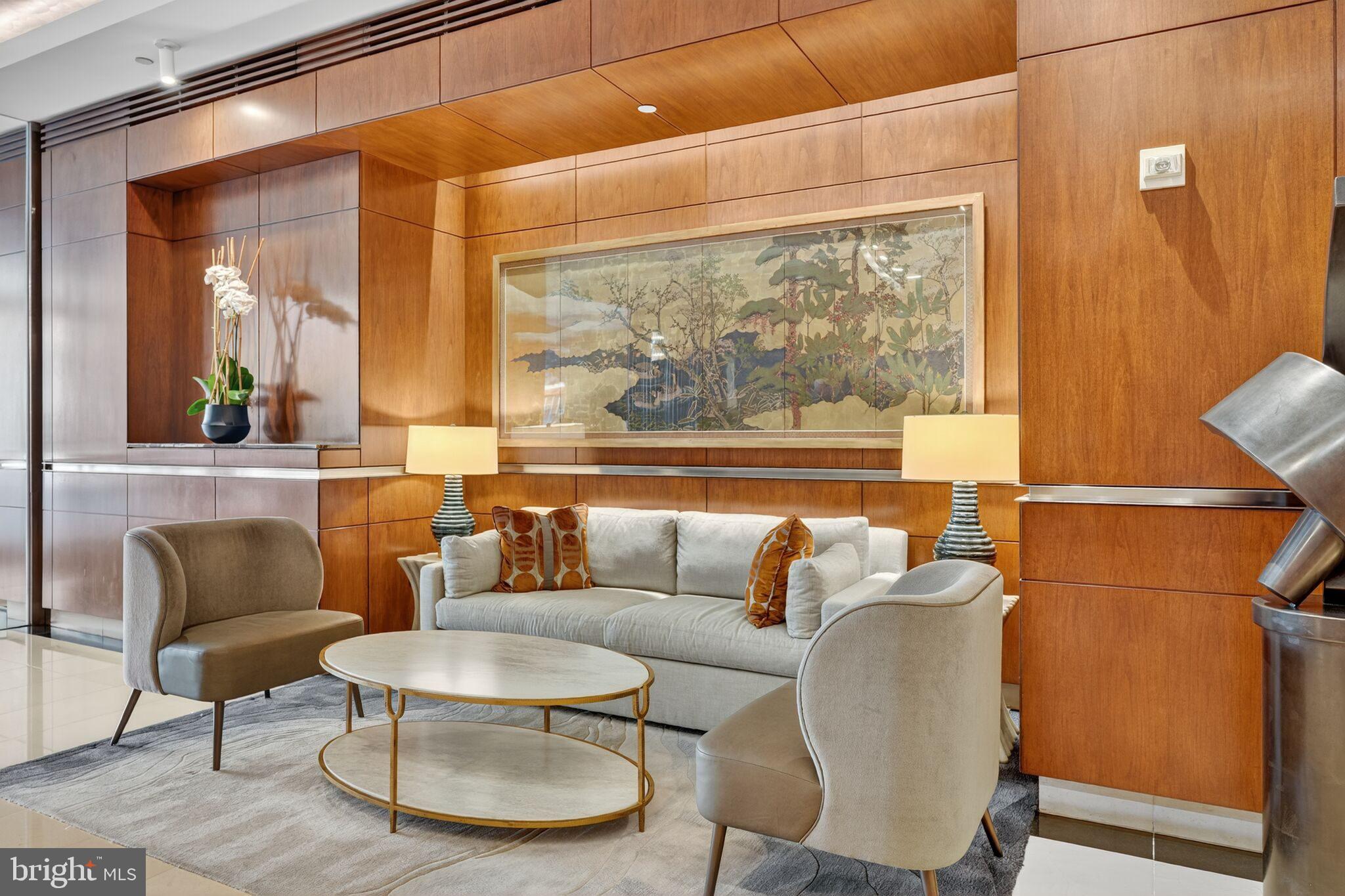 1155 23rd Street Northwest, Unit 3D Washington, DC 20037 - Photo 18 of 22 a living room with furniture and a large window