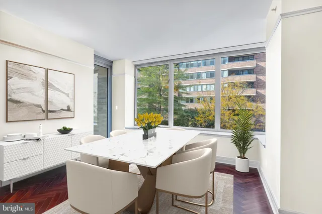 a dining room with furniture and window