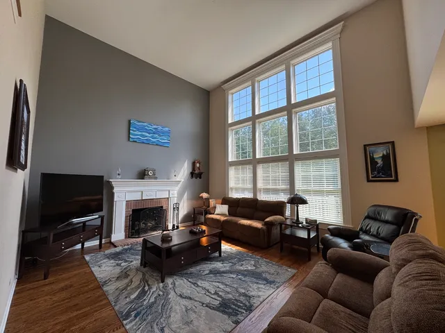 a bedroom with a bed and a flat tv screen on the dresser