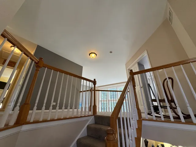 a bathroom with a granite countertop toilet and a sink