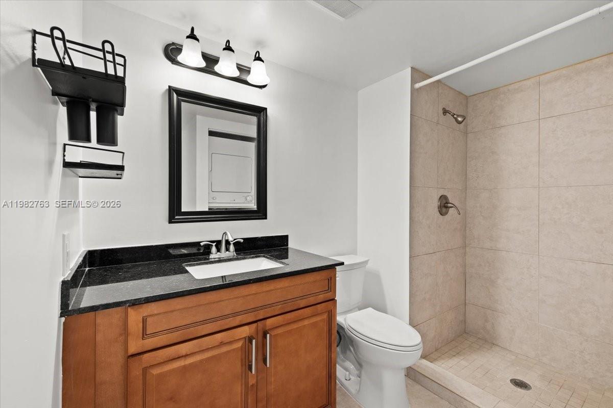 7944 Eastlake Drive, Unit D Boca Raton, FL 33433 - Photo 22 of 29 a bathroom with a sink a toilet and shower