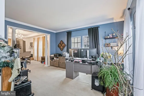 a view of a livingroom with furniture and a window