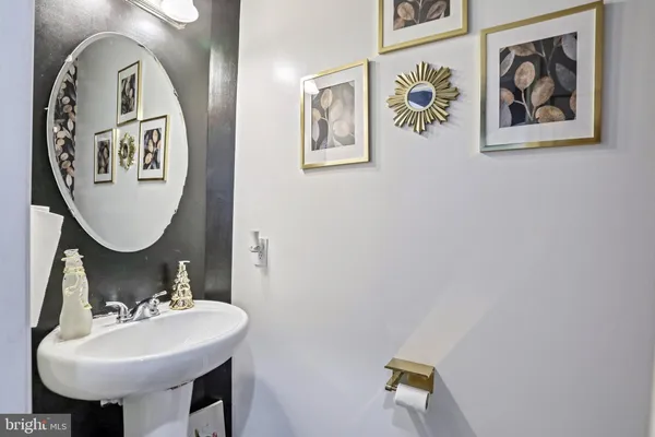 a spacious bedroom with a bed a couch and potted plant