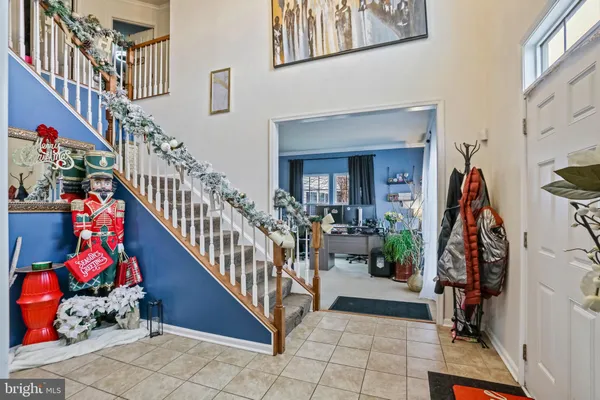 a view of an entryway with wooden floor