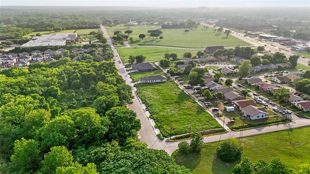 3145 Stag Road Dallas, TX 75241 - Photo 3 of 5 an aerial view of residential houses with outdoor space and trees