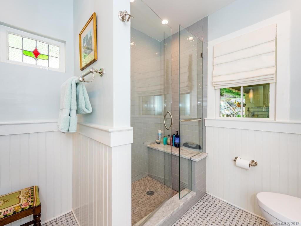 190 Euit Smith Road Tryon, NC 28782 - Photo 16 of 36 a bathroom with a sink a toilet and shower