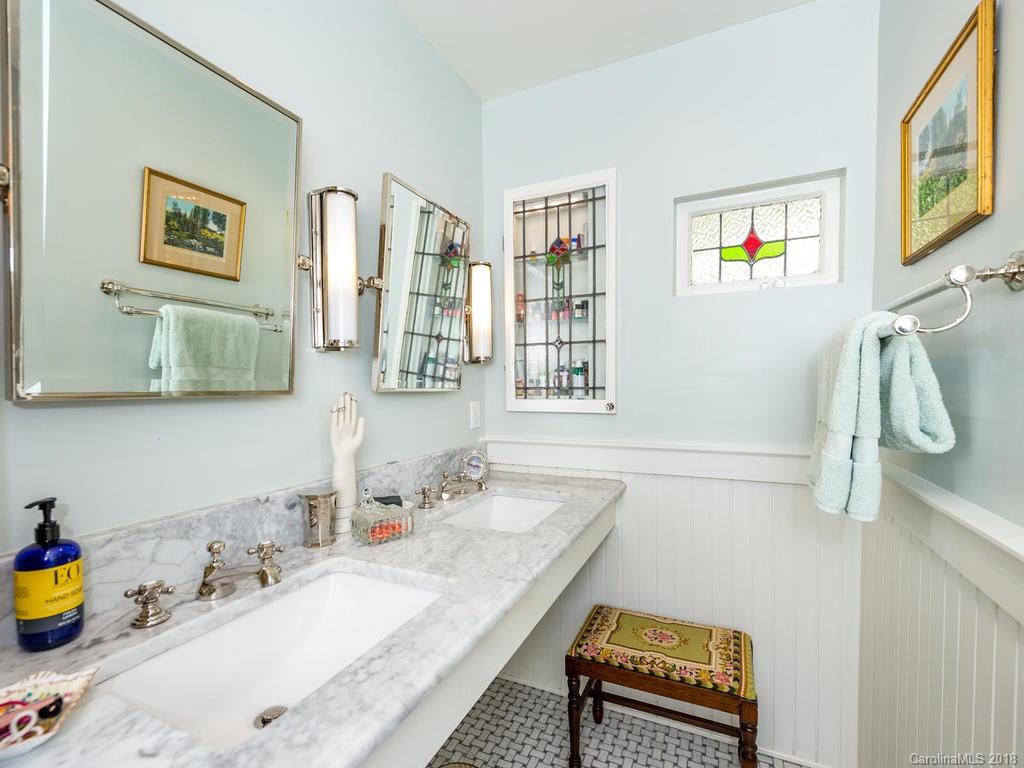 190 Euit Smith Road Tryon, NC 28782 - Photo 17 of 36 a bathroom with a sink a mirror and a window