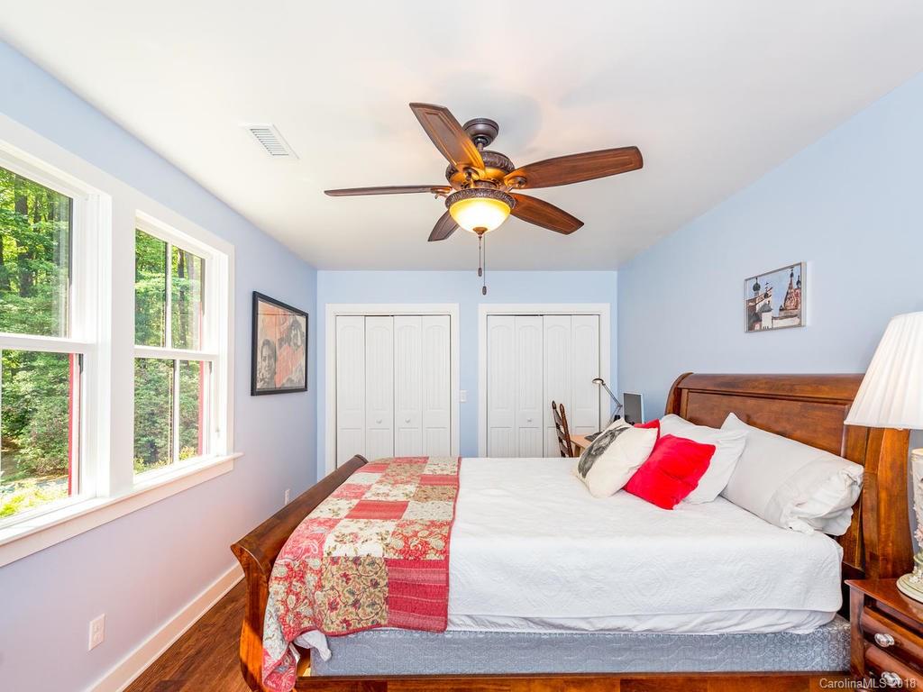 190 Euit Smith Road Tryon, NC 28782 - Photo 18 of 36 a bedroom with a bed and a window