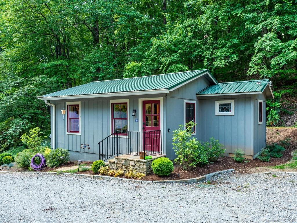 190 Euit Smith Road Tryon, NC 28782 - Photo 24 of 36 a front view of a house with a yard