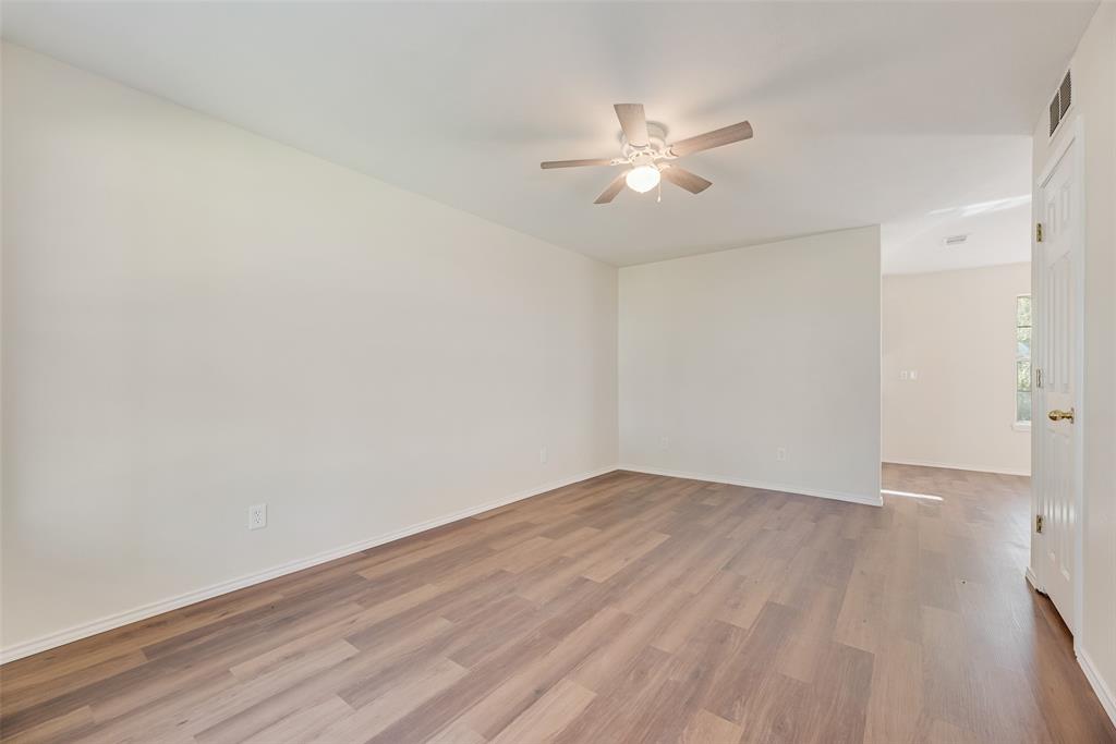 751 County Road 1240 Mount Pleasant, TX 75455 - Photo 8 of 35 a view of an empty room with wooden floor